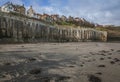 Yorkshire, England, Robin Hood`s Bay - a sandy beach and some houses.. Royalty Free Stock Photo