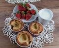 Yorkshire pudding in ceramic ramekin and strawberry