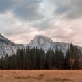 Dramatic sky over Half Dome from Cook`s Meadow. Royalty Free Stock Photo