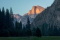 Yosemite National Park view of Half Dome from the Valley during colorful sunset with trees and rocks. California, USA Royalty Free Stock Photo