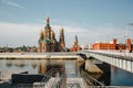 Yoshkar Ola city, Mari El, Russia. The Waterfront Brugges. Fairy town with a beautiful promenade. Spasskaya tower stands on a