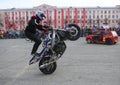 YOSHKAR-OLA, RUSSIA - MAY 5, 2018: Motoshow in the central square of the city. Tricks on a motorcycle, stuntmen, Stunt Riding