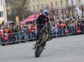 YOSHKAR-OLA, RUSSIA - MAY 5, 2018: Motoshow in the central square of the city. Tricks on a motorcycle, stuntmen, Stunt Riding