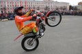 YOSHKAR-OLA, RUSSIA - MAY 5, 2018: Motoshow in the central square of the city. Tricks on a motorcycle, stuntmen, Stunt Riding