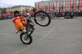 YOSHKAR-OLA, RUSSIA - MAY 5, 2018: Motoshow in the central square of the city. Tricks on a motorcycle, stuntmen, Stunt Riding