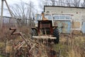 YOSHKAR-OLA, RUSSIA - NOVEMBER 23, 2017: An old abandoned rusty tractor with a working engine.