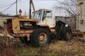 YOSHKAR-OLA, RUSSIA - NOVEMBER 23, 2017: An old abandoned rusty tractor with a working engine.