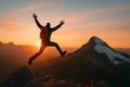 Mountain Peak Exploration: Hiker Soars Into Majestic Sunset Royalty Free Stock Photo