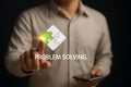 Hand touching problem solving puzzle icon on digital interface Royalty Free Stock Photo