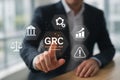 GRC (Governance, Risk, Compliance) Concept with Businessman Interacting on Virtual Interface for Corporate Management Royalty Free Stock Photo