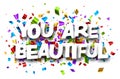 You are beautiful sign on cut ribbon confetti background