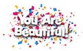 You are beautiful sign on cut ribbon confetti background