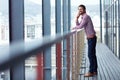 You can always call on me to deliver. a young businessman talking on a phone outside of an office building. Royalty Free Stock Photo