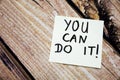 You can do it motivational handwritten message on the white paper with retro wooden bark background. Positive and motivational mes Royalty Free Stock Photo