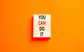 You can do it symbol. Concept word You can do it on beautiful wooden block. Beautiful orange table orange background. Business Royalty Free Stock Photo