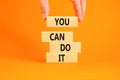 You can do it symbol. Concept word You can do it on beautiful wooden block. Beautiful orange table orange background. Businessman Royalty Free Stock Photo