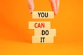 You can do it symbol. Concept word You can do it on beautiful wooden block. Beautiful orange table orange background. Businessman Royalty Free Stock Photo