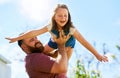 You can fly, my butterfly. an adorable little girl having fun with her father in their backyard. Royalty Free Stock Photo