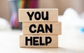 YOU CAN HELP words on wooden blocks Royalty Free Stock Photo