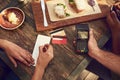 You can just put it on my card. High angle shot of an unrecognizable man ready to pay the bill with his credit card at a Royalty Free Stock Photo