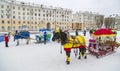 You can ride in a holiday carriage in the city square