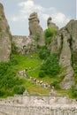 People climb the stairs to reach to top of the fortress in the Belogradchik Rocks formations. Royalty Free Stock Photo