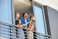 You can see the whole world from up here. a happy young family standing on the balcony of their home. Royalty Free Stock Photo