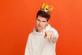 You can! Self confident egoistic man in casual hoodie with golden crown on head pointing finger on you looking at camera,