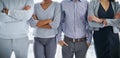 You can tell theyre filled with confidence. an unrecognizable group of businesspeople standing in an office.