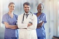 You can trust us with your life. A medical team standing in the hospital corridor. Royalty Free Stock Photo