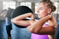 You cant go wrong with strong. a young woman working out with weights at the gym. Royalty Free Stock Photo