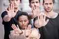 You cant stop a runaway train. a group of protestors raising their hands.