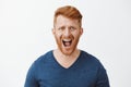 You cheated on me how could you. Upset outraged and unhappy redhead man with bristle, shouting, frowning making Royalty Free Stock Photo