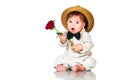 Emotional surprised toddler boy in retro, bow-tie hat and with red rose on white background. Royalty Free Stock Photo