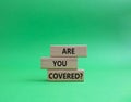 Are you covered symbol. Concept words Are you covered on wooden blocks. Beautiful green background. Business and Are you covered Royalty Free Stock Photo