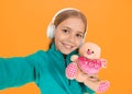 You create my heart smile. Small child hold valentines teddy bear with pink heart. Love you heart inscription. You are