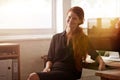 You create your own oppertunities. a young businesswoman sitting at her desk. Royalty Free Stock Photo