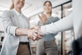 You deserve all the success life has to offer. Shot of two unrecognizable businespeople shaking hands in an office at