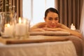 Because you deserve it. A beautiful young woman relaxing on a massage table before her massage. Royalty Free Stock Photo