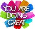 You are doing great paper word sign with colorful spectrum paint brush strokes over white