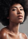 You dont need makeup to feel good about your skin. Studio shot of a young female posing against a grey background. Royalty Free Stock Photo