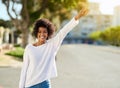 You dont need a map to know where youre going. Portrait of a happy young woman gesturing to catch a cab in the city. Royalty Free Stock Photo