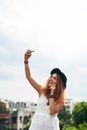 You dont need a reason to feel good about yourself. a young woman taking a selfie against a urban background. Royalty Free Stock Photo