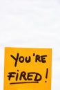 You are fired handwriting text close up isolated on orange paper with copy space Royalty Free Stock Photo