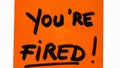 You are fired handwriting text close up isolated on orange paper with copy space Royalty Free Stock Photo