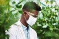 You first have to protect yourself against plant allergies. a young botanist wearing protective eye and face gear while Royalty Free Stock Photo