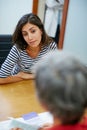 You always give me such great advice. Rearview shot of a woman in a meeting with her financial advisor.