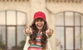 You are in good hands. Happy child pointing fingers straight outdoors. Marketing and advertising. Advertisement and