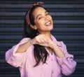 You got it. Cropped portrait of an attractive young woman punching the air playfully while posing against a grey Royalty Free Stock Photo