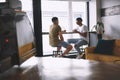 You had me at Lets go for coffee. two young men talking while having coffee together in a cafe. Royalty Free Stock Photo